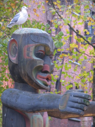 pigeon atop native statue 1